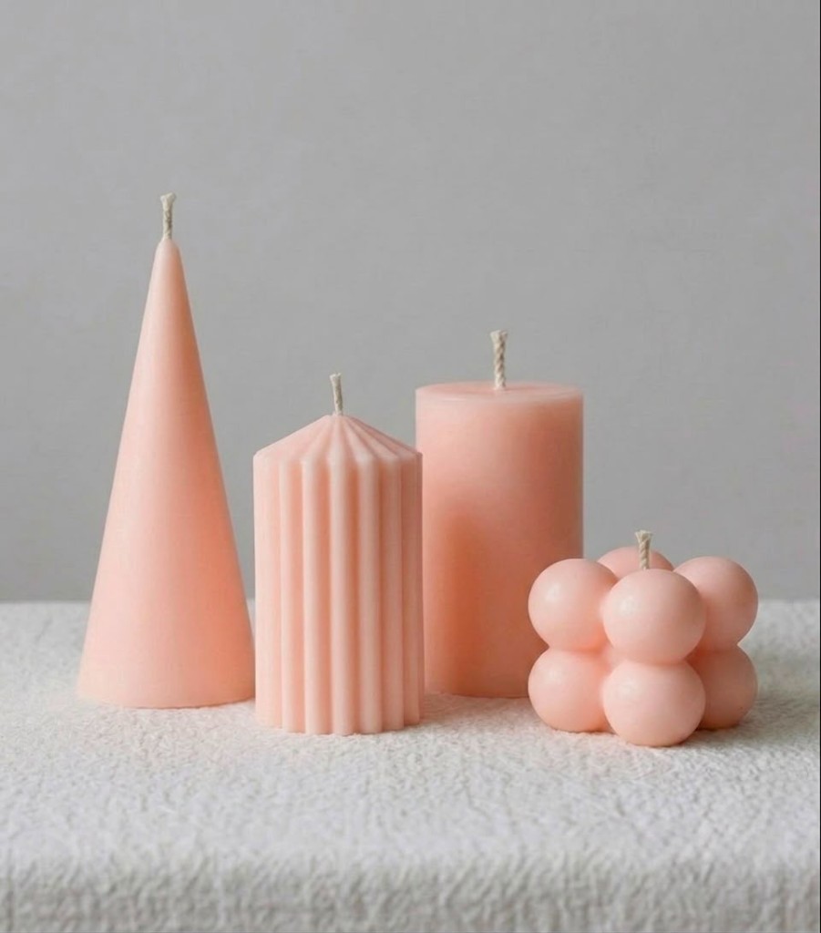 Set of sculptural peach candles